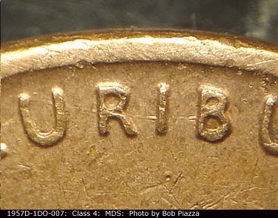 Die-stage B marker on 1957D•1DO•007 (1957 Doubled Die Obverse).