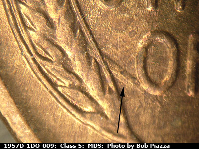 Die-stage B marker on 1957D•1DO•009 (1957 Doubled Die Obverse).