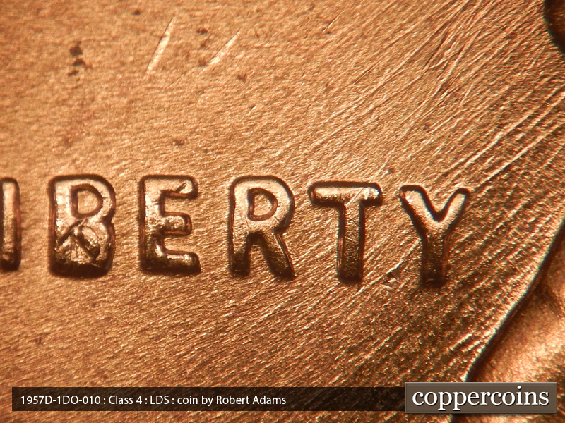 Die-stage C marker on 1957D•1DO•010 (1957 Doubled Die Obverse).