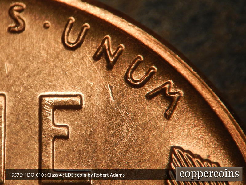 Die-stage C marker on 1957D•1DO•010 (1957 Doubled Die Obverse).