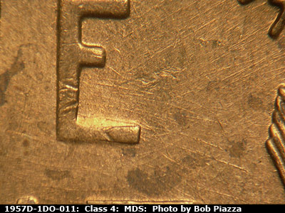Die-stage B marker on 1957D•1DO•011 (1957 Doubled Die Obverse).