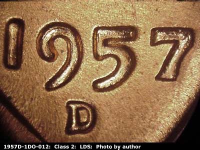 Die-stage C marker on 1957D•1DO•012 (1957 Doubled Die Obverse).