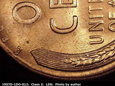 Die-stage C marker on 1957D•1DO•012 (1957 Doubled Die Obverse).