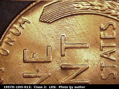 Die-stage C marker on 1957D•1DO•012 (1957 Doubled Die Obverse).
