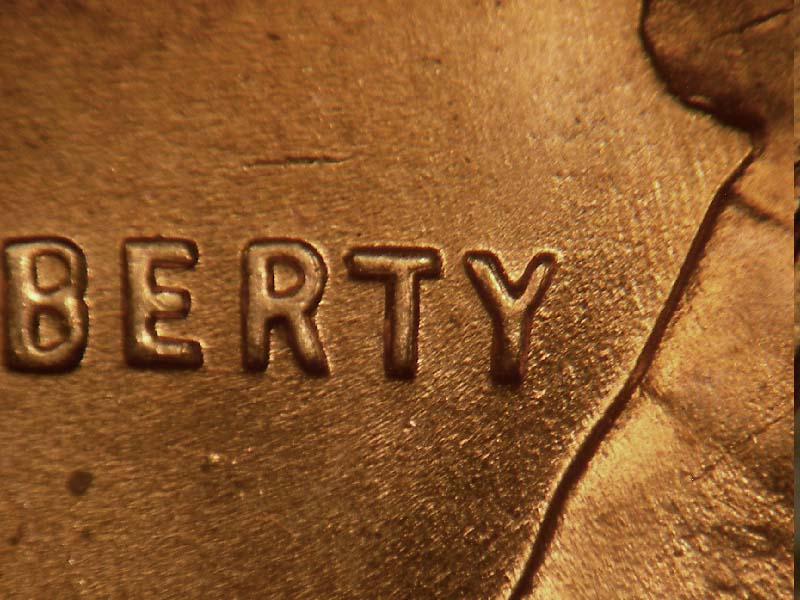 Die-stage B marker on 1957D•1DO•014 (1957 Doubled Die Obverse).