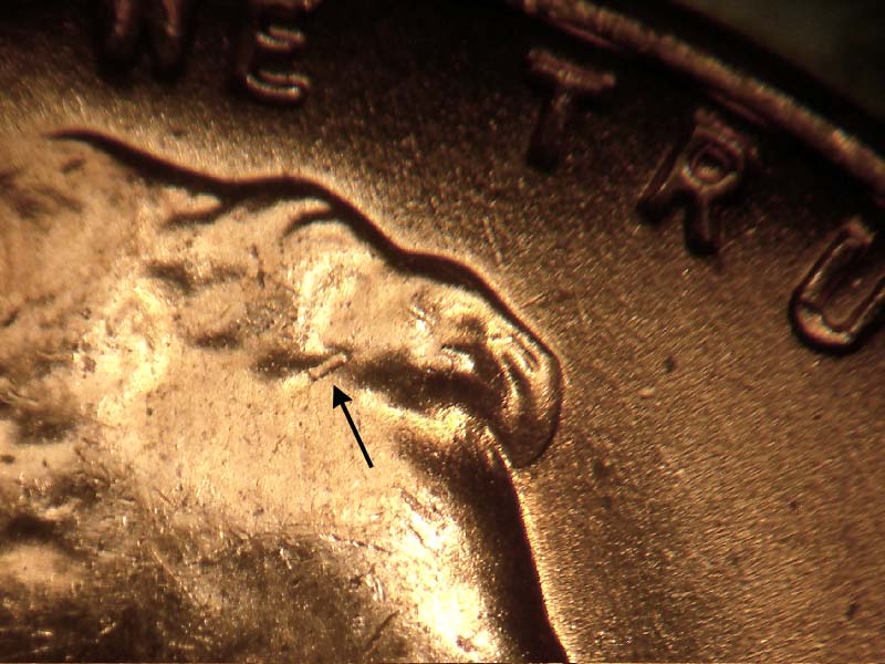 Die-stage B marker on 1957D•1DO•014 (1957 Doubled Die Obverse).