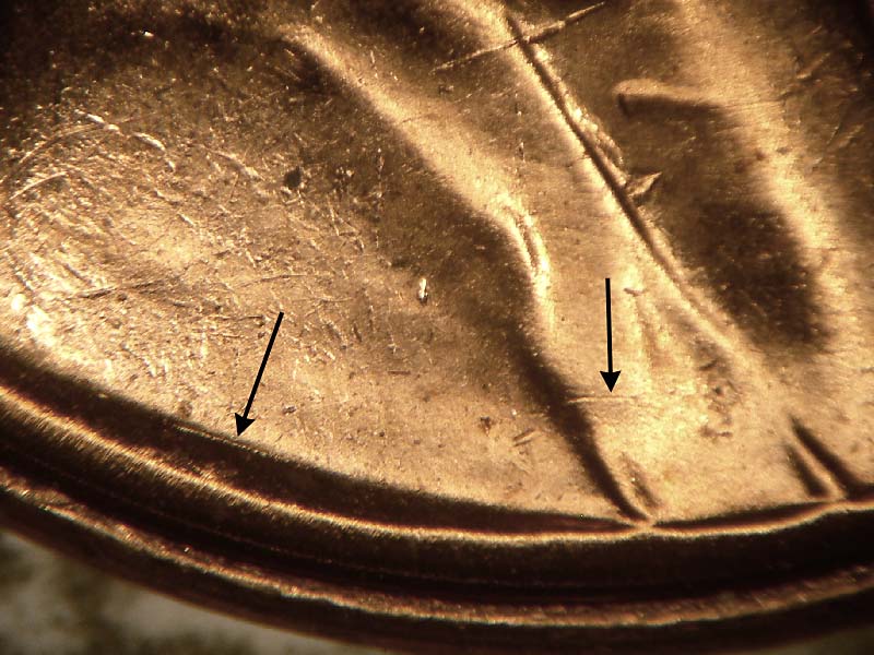 Die-stage B marker on 1957D•1DO•014 (1957 Doubled Die Obverse).