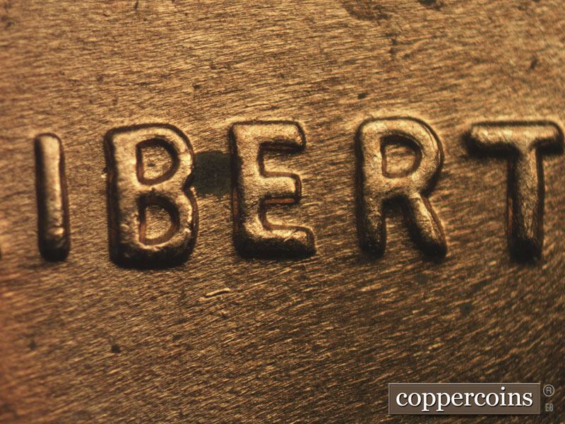Die-stage C marker on 1957D•1DO•014 (1957 Doubled Die Obverse).