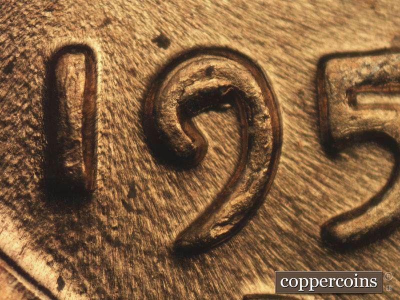 Die-stage C marker on 1957D•1DO•014 (1957 Doubled Die Obverse).