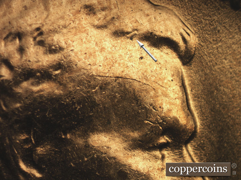 Die-stage C marker on 1957D•1DO•014 (1957 Doubled Die Obverse).