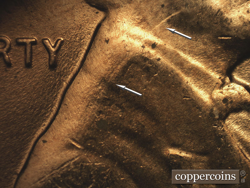 Die-stage C marker on 1957D•1DO•014 (1957 Doubled Die Obverse).