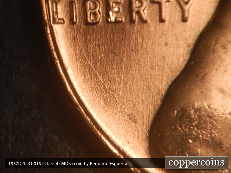 Die-stage B marker on 1957D•1DO•015 (1957 Doubled Die Obverse).