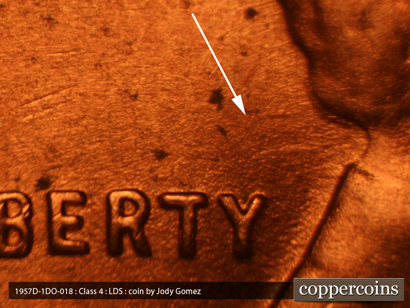 Die-stage C marker on 1957D•1DO•018 (1957 Doubled Die Obverse).