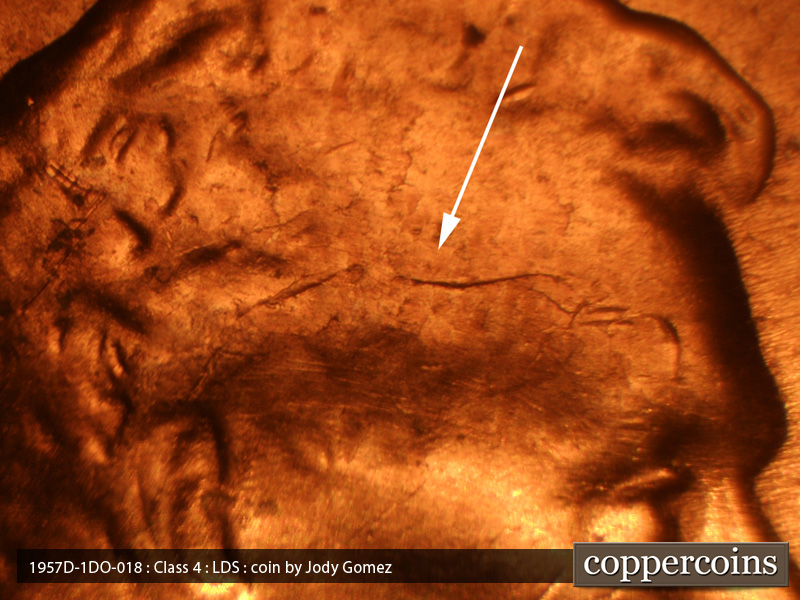 Die-stage C marker on 1957D•1DO•018 (1957 Doubled Die Obverse).