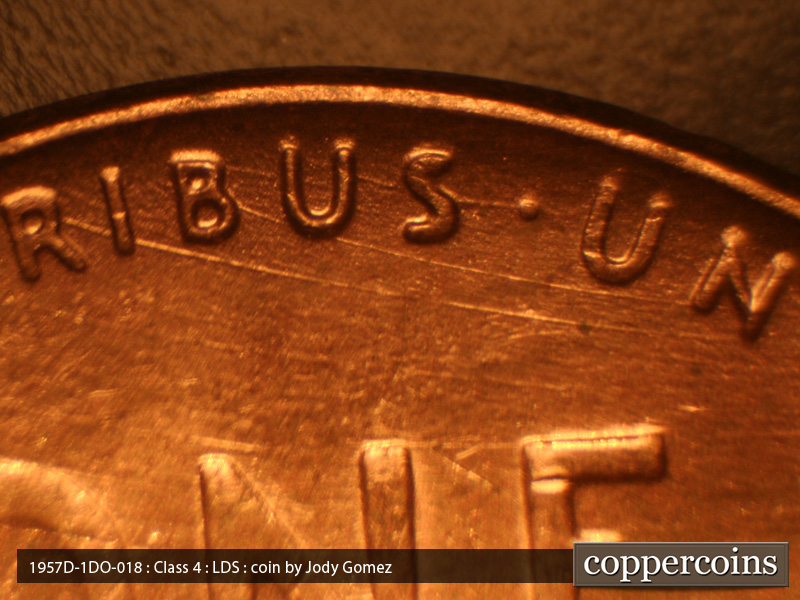 Die-stage C marker on 1957D•1DO•018 (1957 Doubled Die Obverse).