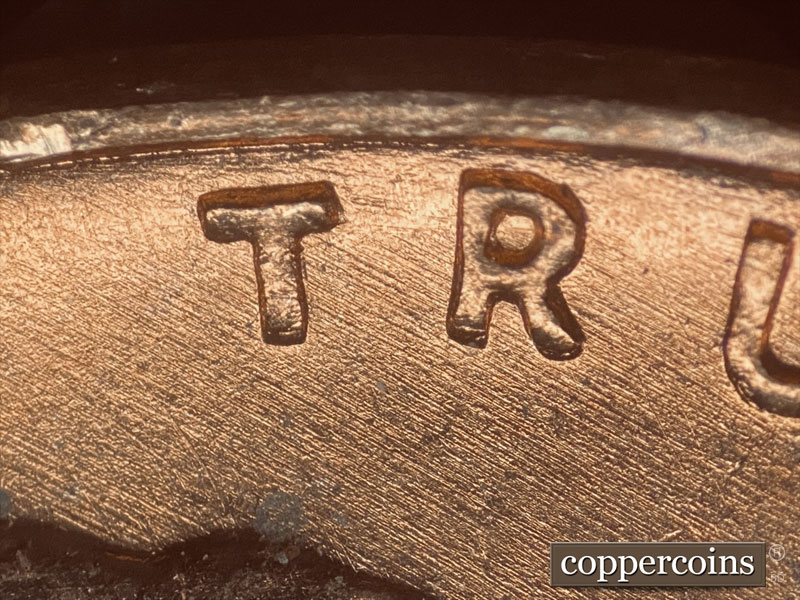 Die-stage B marker on 1957D•1DO•021 (1957 Doubled Die Obverse).