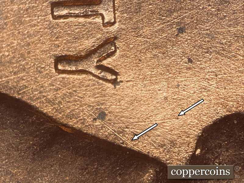 Die-stage B marker on 1957D•1DO•021 (1957 Doubled Die Obverse).