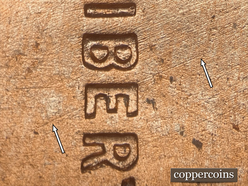 Die-stage B marker on 1957D•1DO•021 (1957 Doubled Die Obverse).