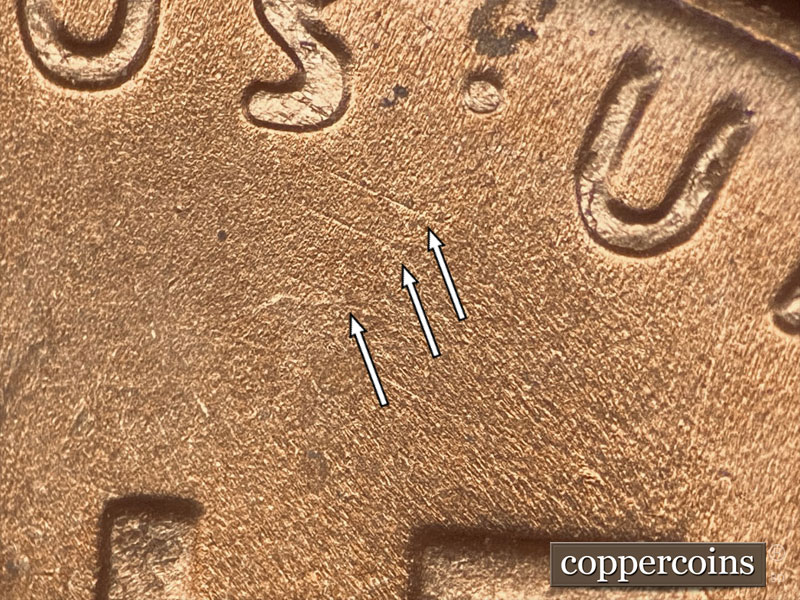 Die-stage B marker on 1957D•1DO•021 (1957 Doubled Die Obverse).