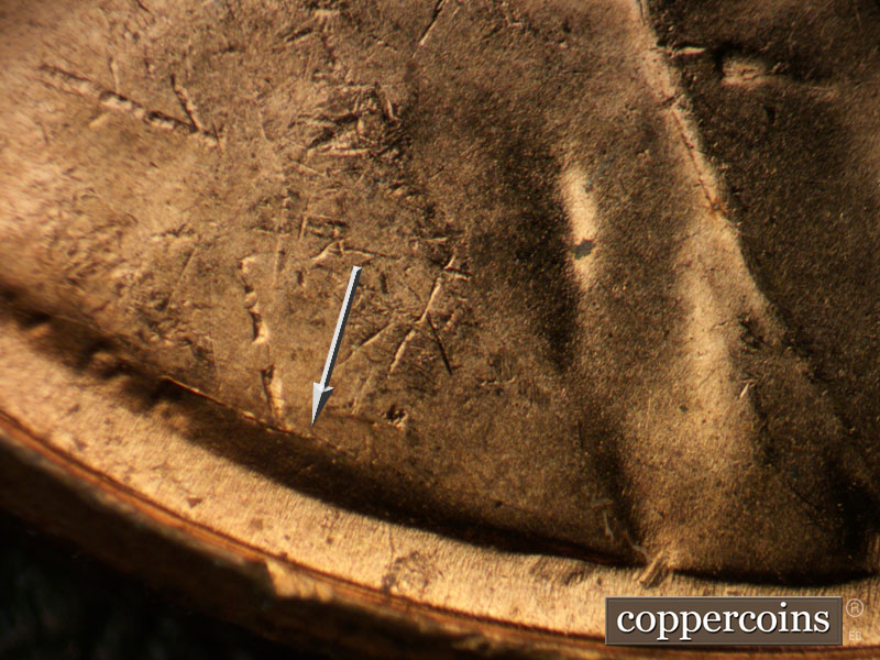 Die-stage B marker on 1957D•1DO•022 (1957 Doubled Die Obverse).