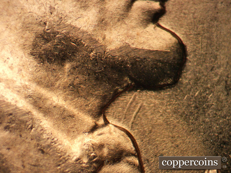 Die-stage B marker on 1957D•1DO•022 (1957 Doubled Die Obverse).