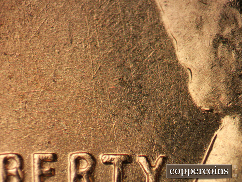 Die-stage B marker on 1957D•1DO•022 (1957 Doubled Die Obverse).