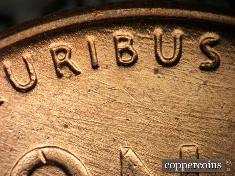 Die-stage B marker on 1957D•1DO•022 (1957 Doubled Die Obverse).