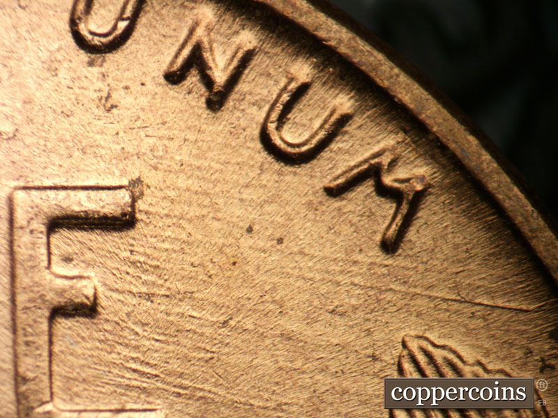 Die-stage B marker on 1957D•1DO•022 (1957 Doubled Die Obverse).