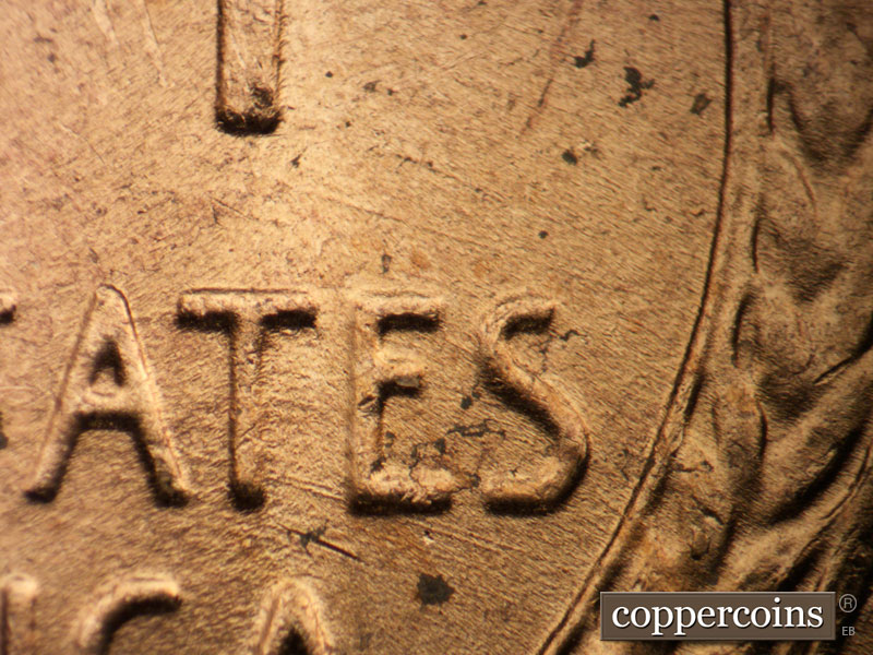 Die-stage B marker on 1957D•1DO•022 (1957 Doubled Die Obverse).