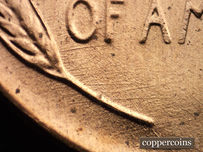 Die-stage B marker on 1957D•1DO•023 (1957 Doubled Die Obverse).