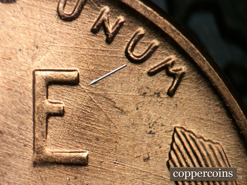 Die-stage B marker on 1957D•1DO•024 (1957 Doubled Die Obverse).