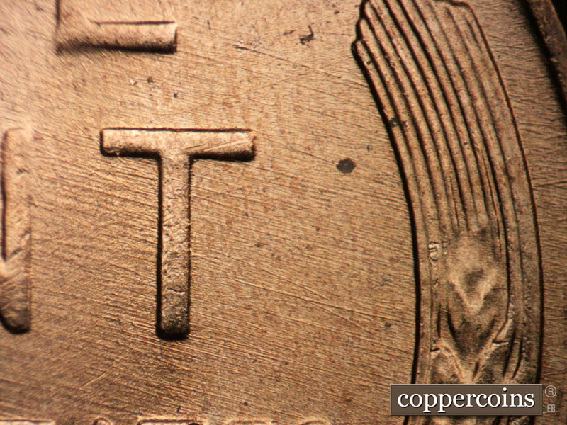 Die-stage B marker on 1957D•1DO•024 (1957 Doubled Die Obverse).