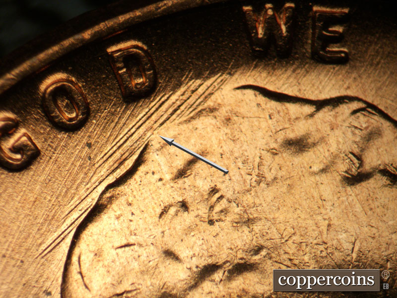 Die-stage B marker on 1957D•1DO•025 (1957 Doubled Die Obverse).
