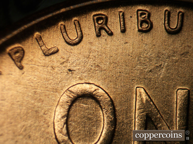 Die-stage B marker on 1957D•1DO•025 (1957 Doubled Die Obverse).