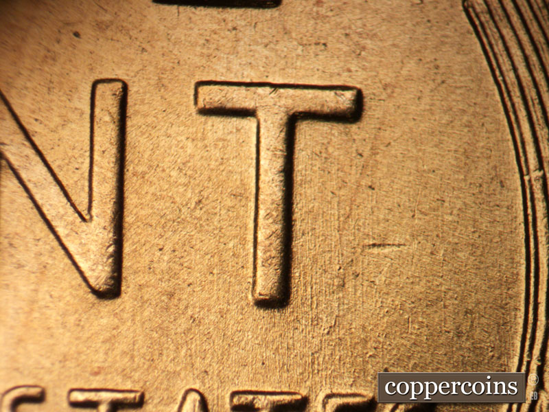 Die-stage B marker on 1957D•1DO•025 (1957 Doubled Die Obverse).