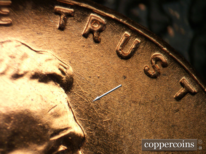 Die-stage B marker on 1957D•1DO•027 (1957 Doubled Die Obverse).