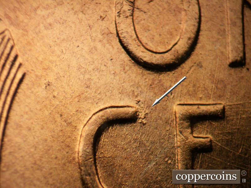 Die-stage B marker on 1957D•1DO•027 (1957 Doubled Die Obverse).