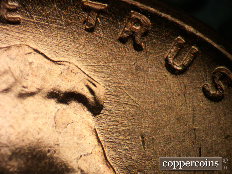 Die-stage B marker on 1957D•1DO•028 (1957 Doubled Die Obverse).