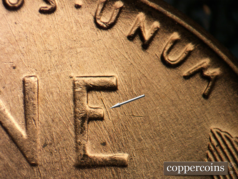 Die-stage B marker on 1957D•1DO•028 (1957 Doubled Die Obverse).