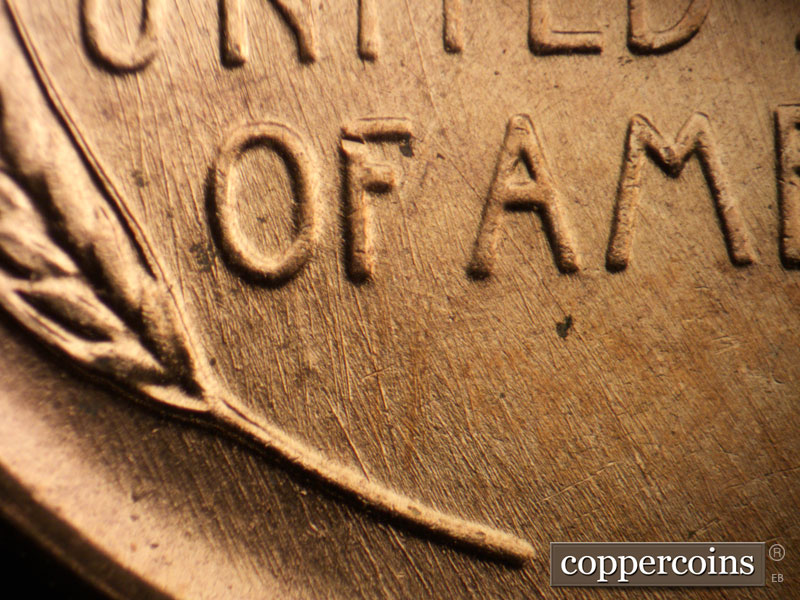 Die-stage B marker on 1957D•1DO•028 (1957 Doubled Die Obverse).