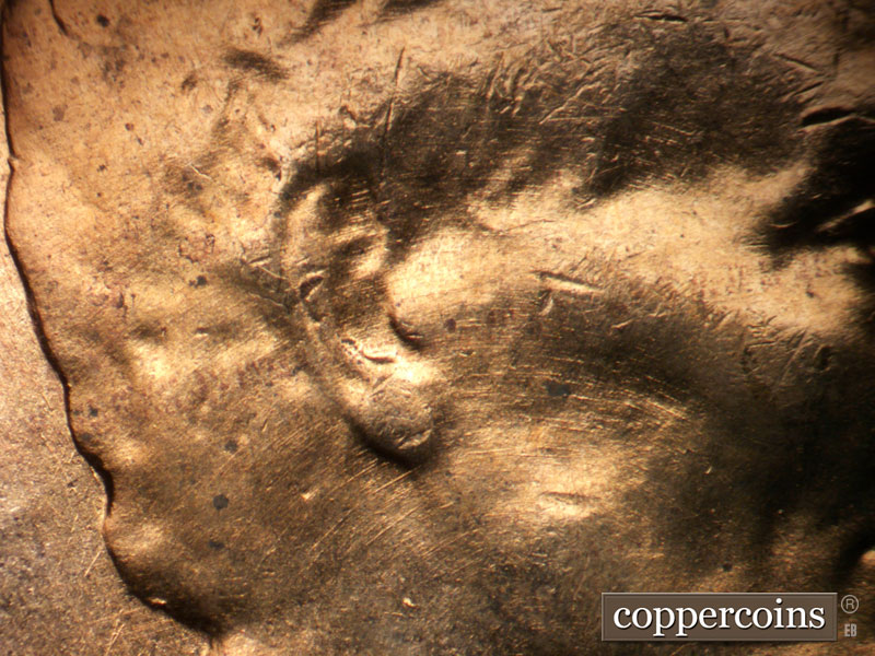 Die-stage B marker on 1957D•1DO•030 (1957 Doubled Die Obverse).
