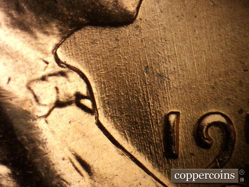 Die-stage B marker on 1957D•1DO•031 (1957 Doubled Die Obverse).