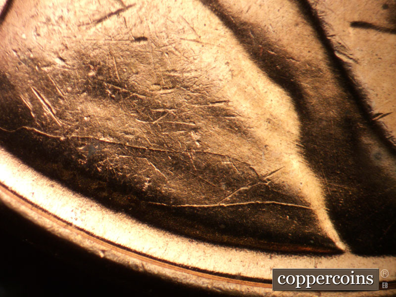 Die-stage C marker on 1957D•1DO•031 (1957 Doubled Die Obverse).