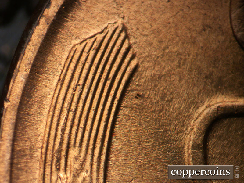 Die-stage C marker on 1957D•1DO•031 (1957 Doubled Die Obverse).