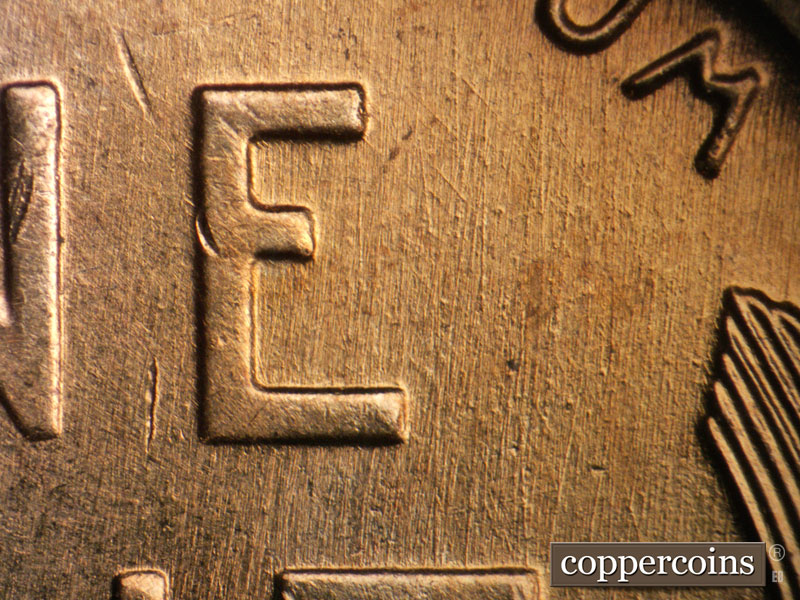 Die-stage B marker on 1957D•1DO•032 (1957 Doubled Die Obverse).