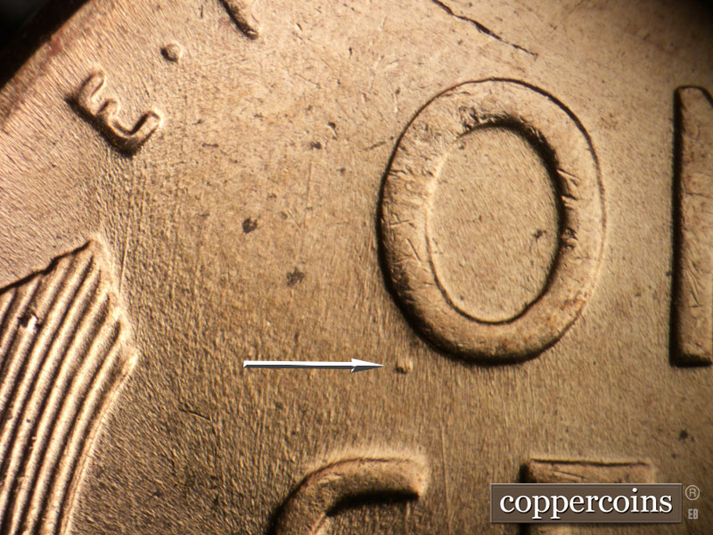 Die-stage B marker on 1957D•1DO•033 (1957 Doubled Die Obverse).