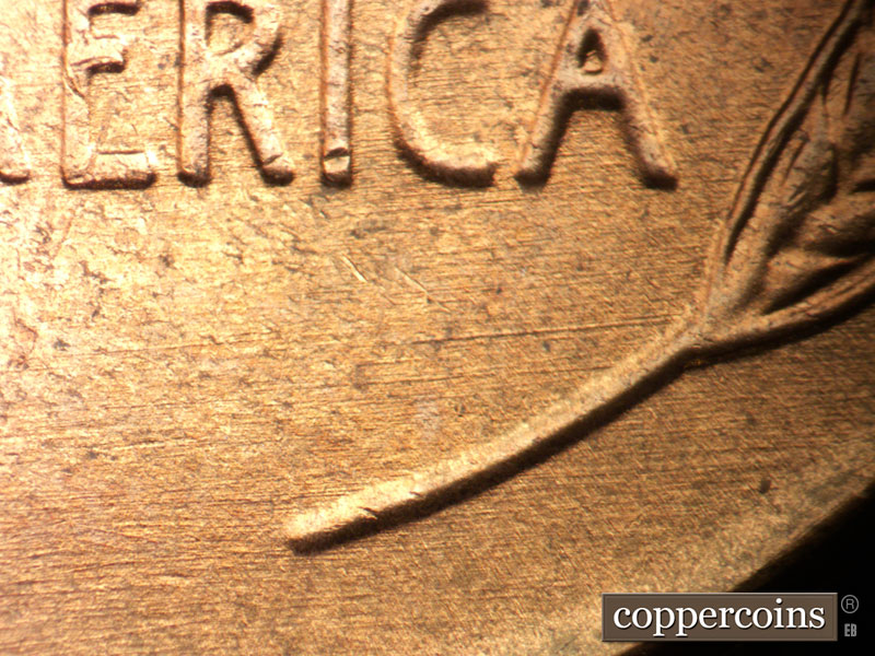 Die-stage B marker on 1957D•1DO•034 (1957 Doubled Die Obverse).