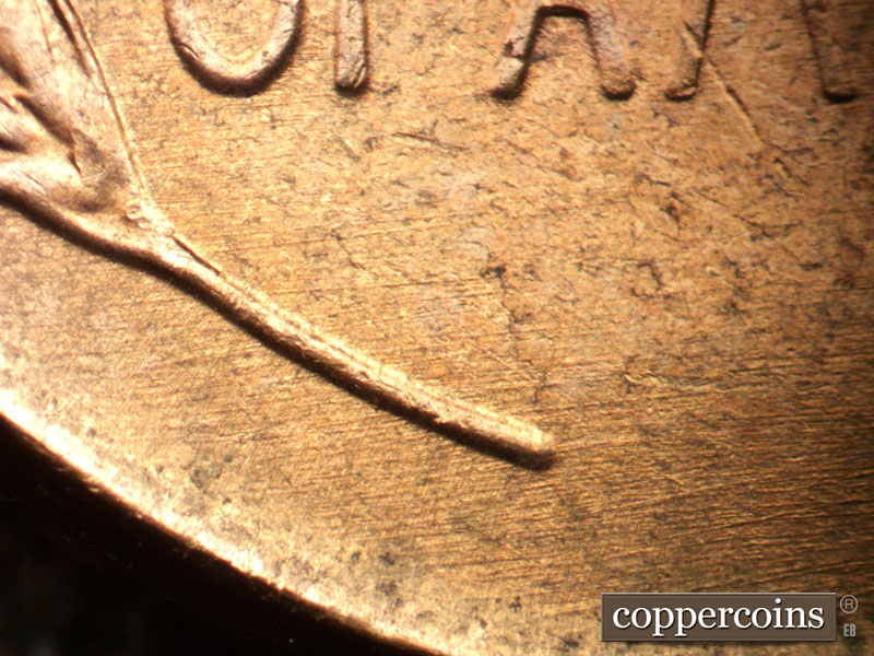Die-stage B marker on 1957D•1DO•034 (1957 Doubled Die Obverse).
