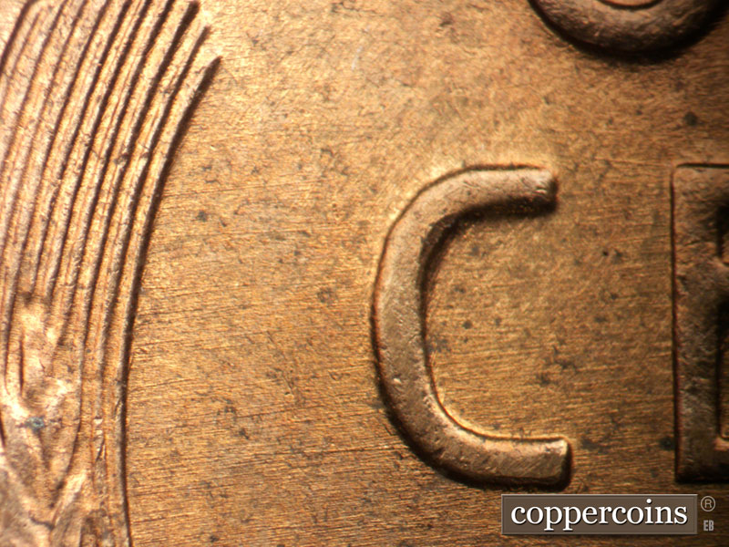 Die-stage B marker on 1957D•1DO•034 (1957 Doubled Die Obverse).