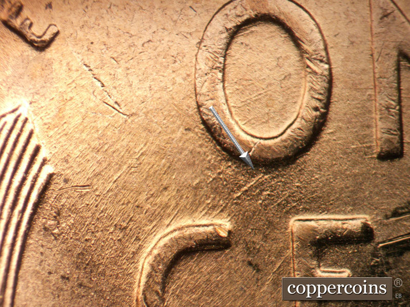 Die-stage B marker on 1957D•1DO•035 (1957 Doubled Die Obverse).